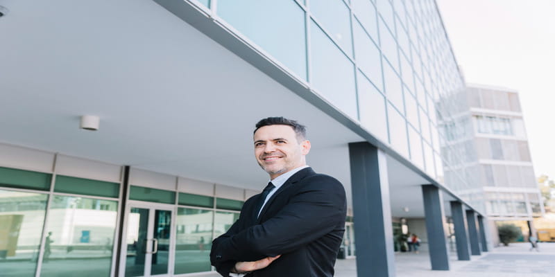 Facility manager outside a modern office building
