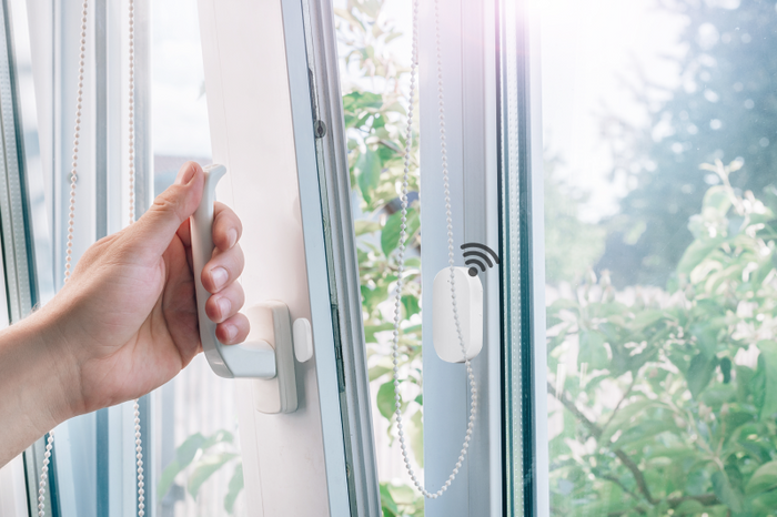 Door and window sensor mounted on a window frame